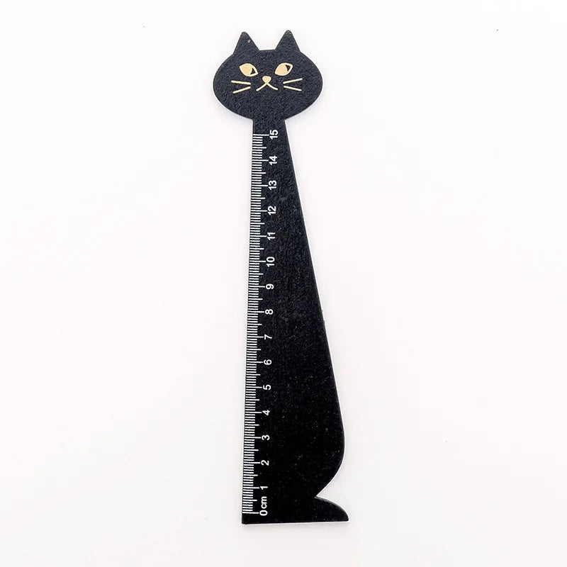 A black wooden drawing ruler shaped like a cat
