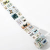 A roll of vintage stamp tape stickers for scrapbooking featuring various butterfly and nature themed designs.