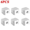 Six white magnetic cable clips designed for desk organization