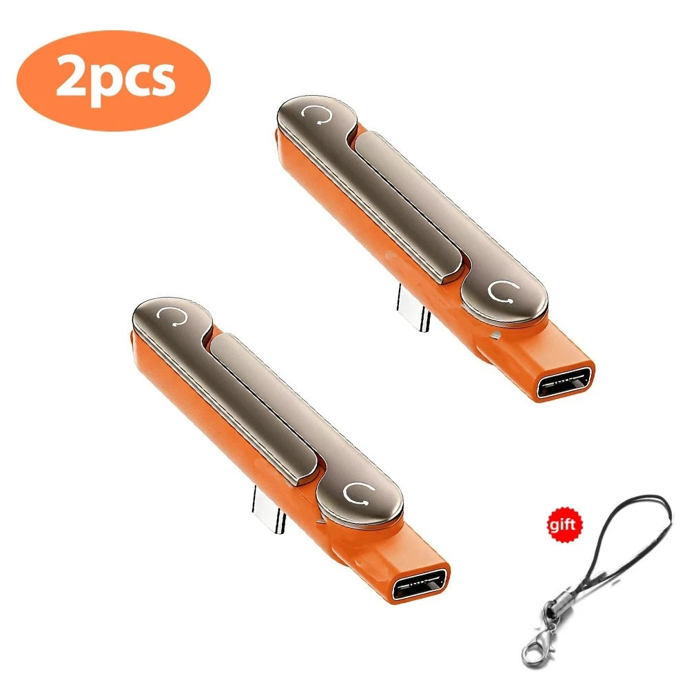 Two orange USB-C adapters with foldable stands for fast charging and data sync
