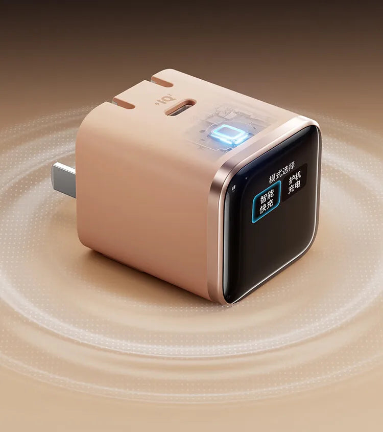 A beige smart display charger device with a black screen and blue indicator light, shown on a smooth surface.