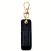 A black leather pen holder keychain with a gold-toned clasp and ring.