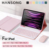 A pink iPad keyboard case with a trackpad and keyboard is shown next to a wireless mouse.
