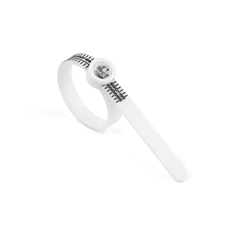 A white ring sizer and measuring tool with a magnifier is shown against a white background.