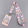 A pink lanyard with a rainbow pattern and a pink ID badge holder featuring the text BE KIND