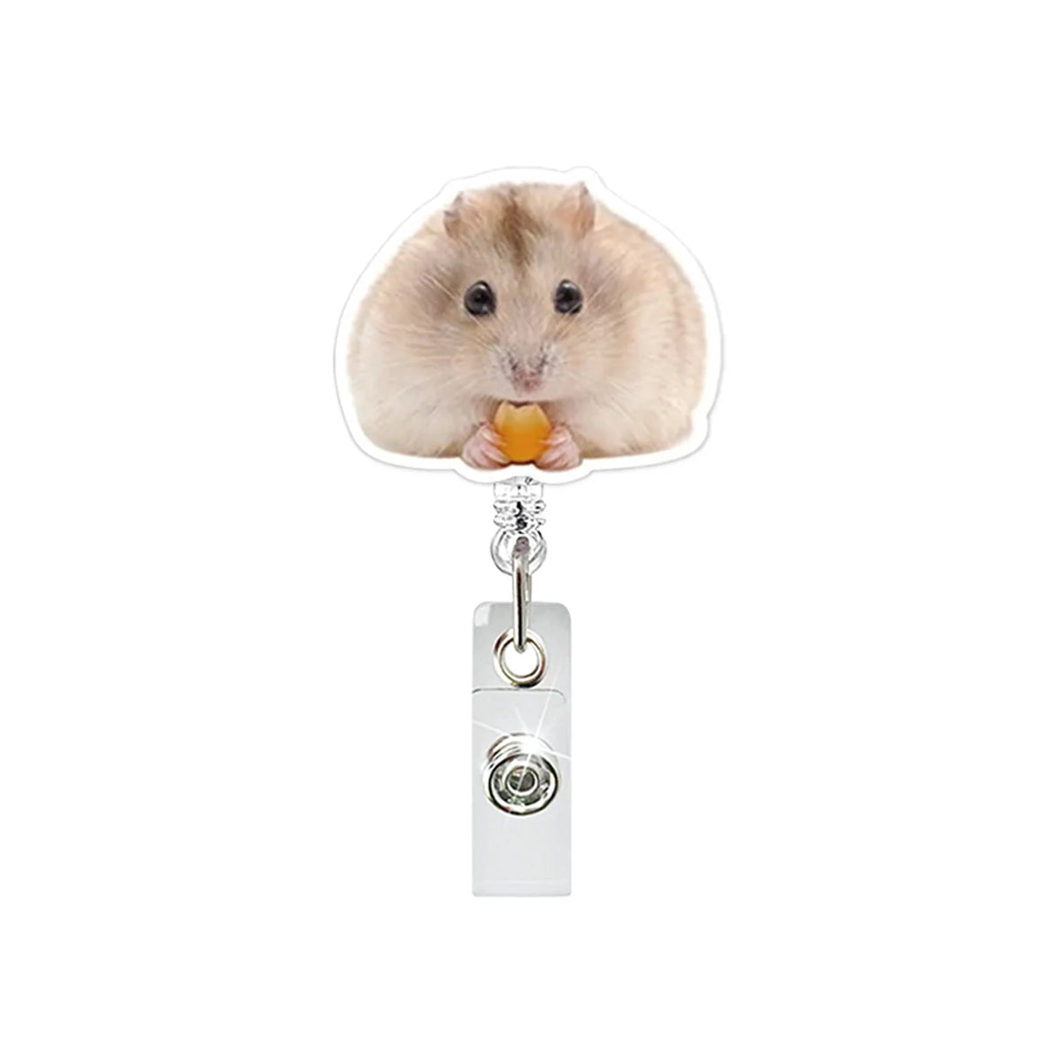 A fluffy light brown hamster is holding a piece of orange food, featured on an acrylic badge reel.