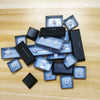 A collection of replacement keycaps for a keyboard, including enter, shift, and backspace keys.