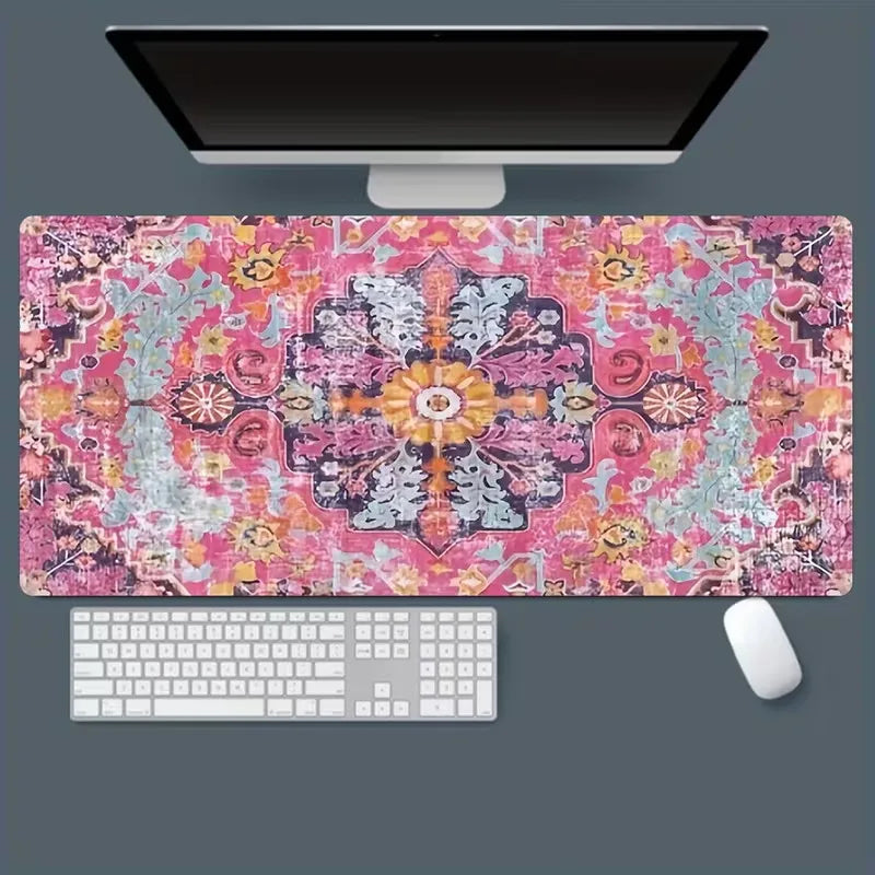 A vintage Persian rug patterned gaming mouse pad with a non-slip rubber base, positioned under a computer monitor.