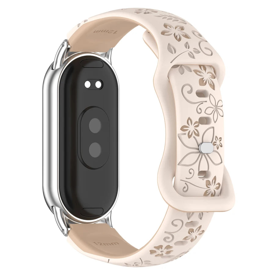A beige silicone watch band with a silver casing and black face, featuring 3D engraved flowers.