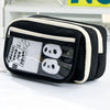 Black pencil case with a transparent flip pocket displaying two white panda-shaped items.