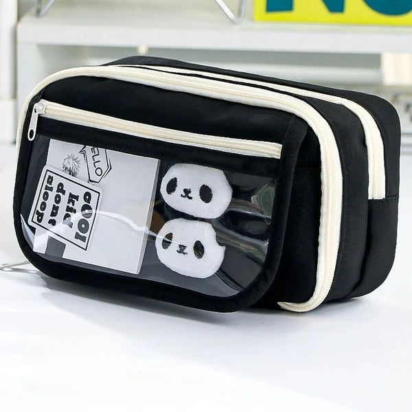 Black pencil case with a transparent flip pocket displaying two white panda-shaped items.