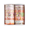 A set of metallic gold washi tape rolls in a white box featuring various patterns for journaling and crafts.