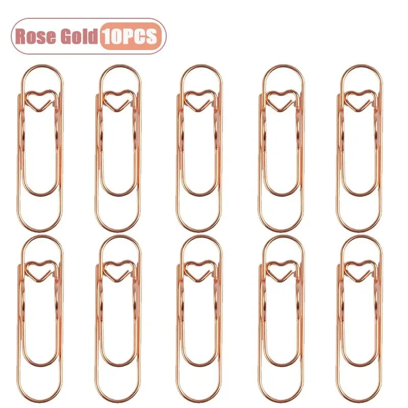 Set of ten rose gold metal pen clips for notebooks and journals