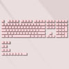 A close-up view of a custom printed pink jelly keycap set for a mechanical keyboard.