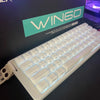 A white wired compact gaming keyboard with blue backlighting is shown in a box.