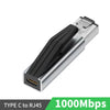 كابل محول فضي من USB-C إلى RJ45 مع غلاف حماية أسود.
