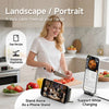 A woman uses a data cable free tool to chop vegetables while a phone stand supports charging.