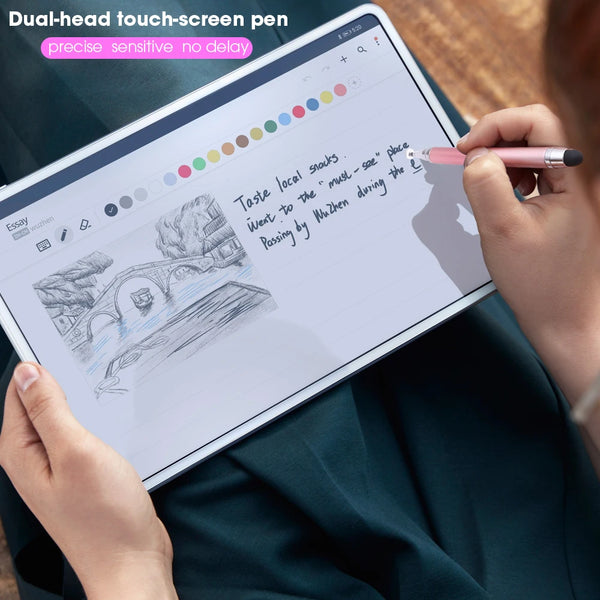 A hand holds a dual-head touch-screen pen writing on a tablet displaying text and drawings.