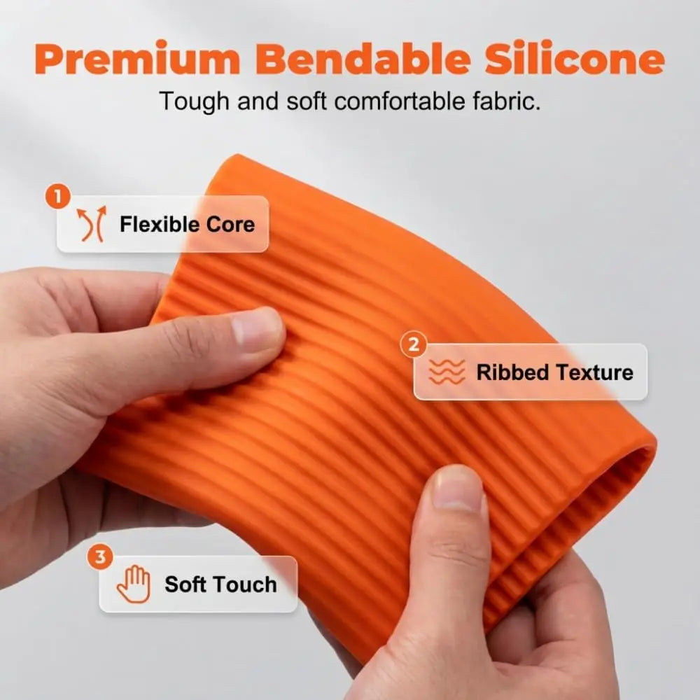 A hand holds an orange silicone fabric product showing its ribbed texture and soft touch.