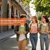 Three young women smiling while holding A5 spiral bound planners in a sunny city street