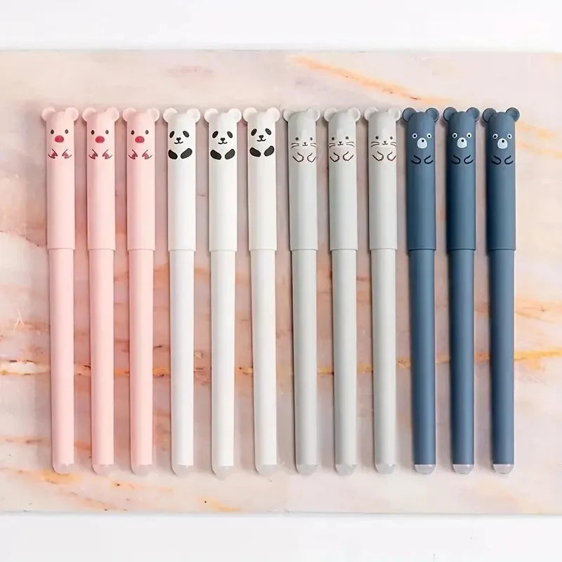 A set of 10 panda-themed gel pens with various colors and designs arranged in a row on a marble surface.