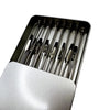 A silver magnetic painting stand holding multiple paintbrushes in a tray.