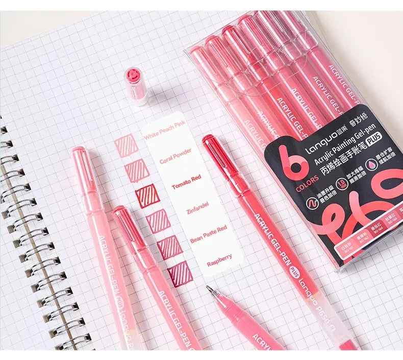 A set of 144 vibrant acrylic gel-pen markers in various shades of pink and red laid out on a white grid paper.