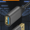 A close-up view of a black USB 3.0 extension cable with a gold connector, showing the braided nylon wire.
