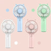 Three mini handheld fans in light blue, mint green, and pink colors shown against a soft background.