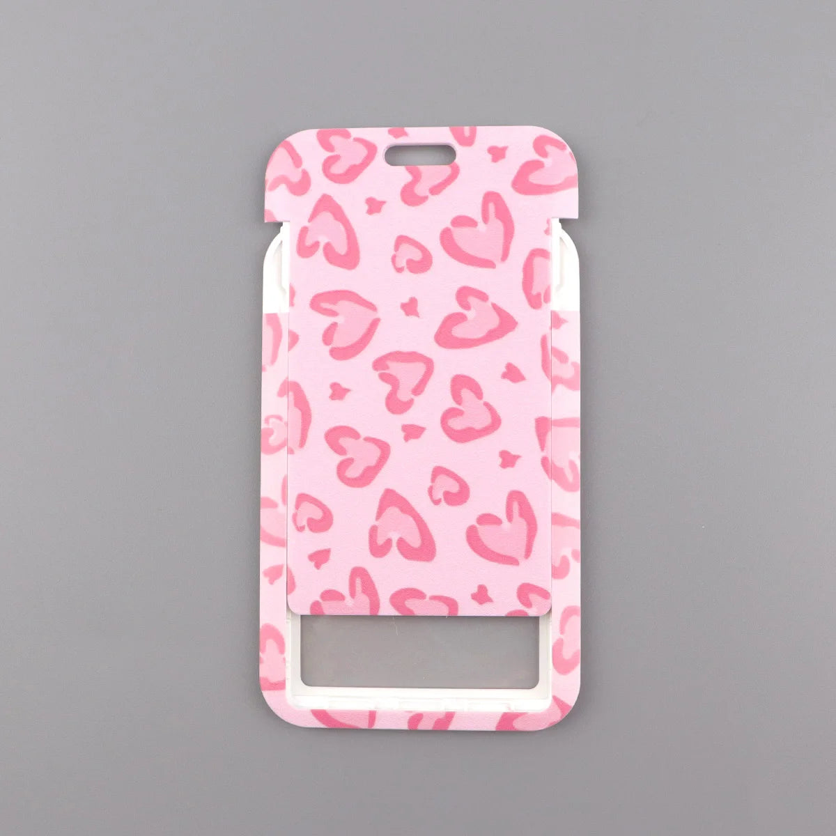 A pink heart-shaped lanyard with a leopard print pattern for badges and keys.