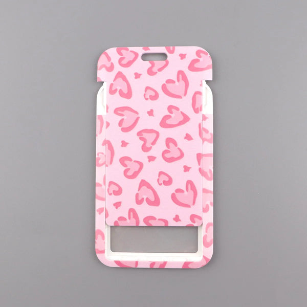 A pink heart-shaped lanyard with a leopard print pattern for badges and keys.