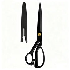 A pair of black professional tailor scissors with gold accents.