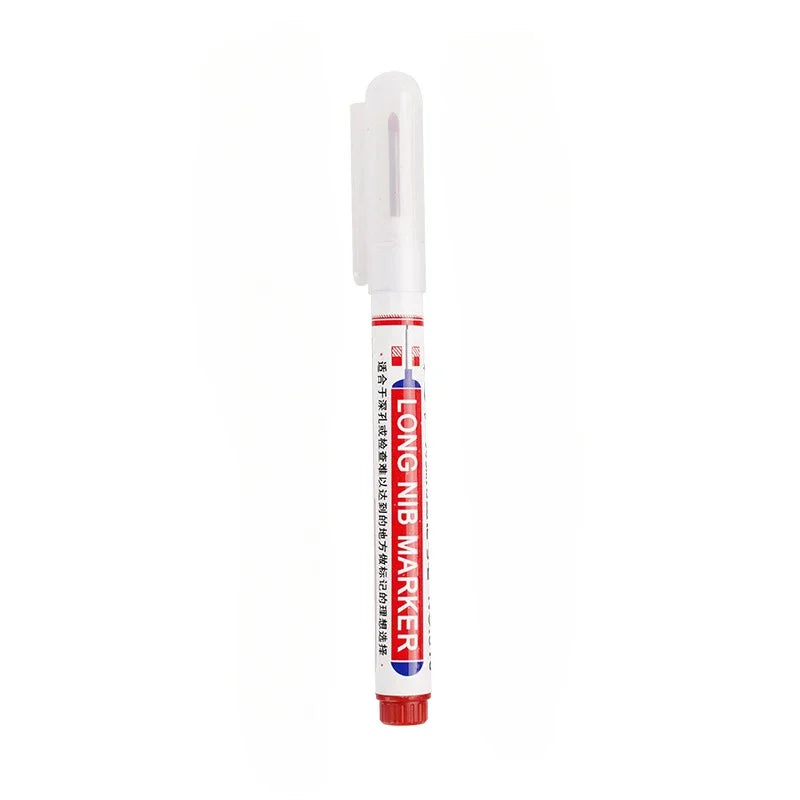 A white permanent paint marker pen with a clear tip and red body is shown vertically.
