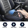 A hand uses a handheld air blower to clean the upholstery of a car seat.