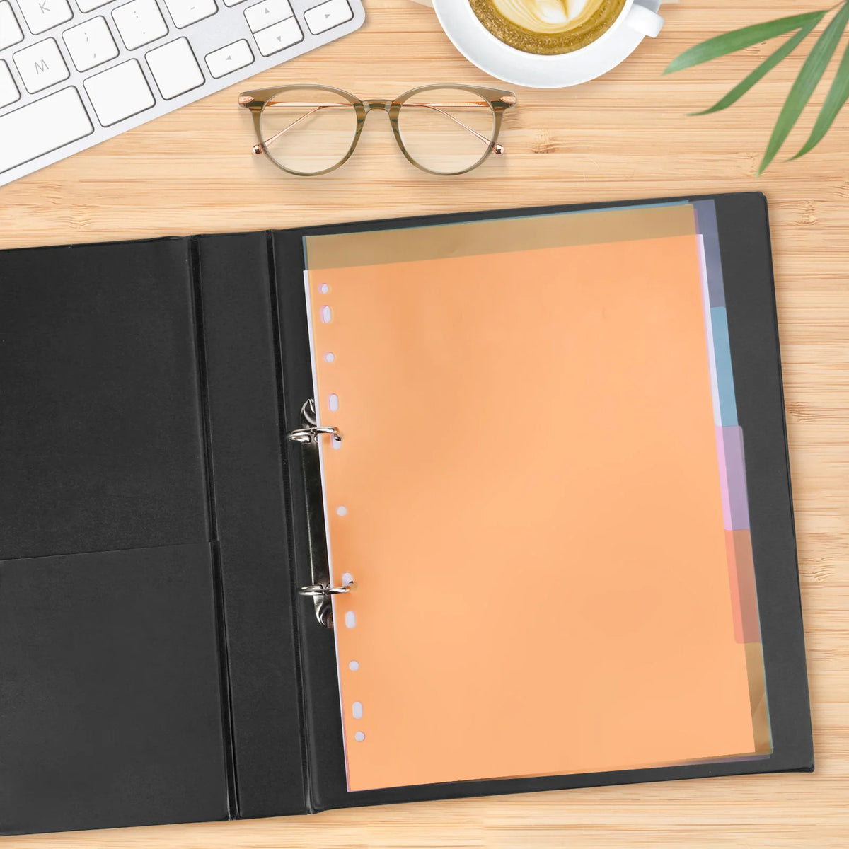 A4 index dividers with tabs for binders and notebooks placed on a wooden desk next to a laptop and coffee cup.