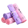 A stack of pink and purple reusable plastic mailing bags with cute cloud designs.