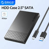 A black ORICO HDD Case 2.5" SATA drive enclosure with a USB cable connected.