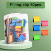 A clear plastic container filled with 50 colorful binder clips and individual clips.