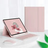A pink magnetic keyboard case for an iPad Pro is shown next to a laptop and a mouse on a white surface.