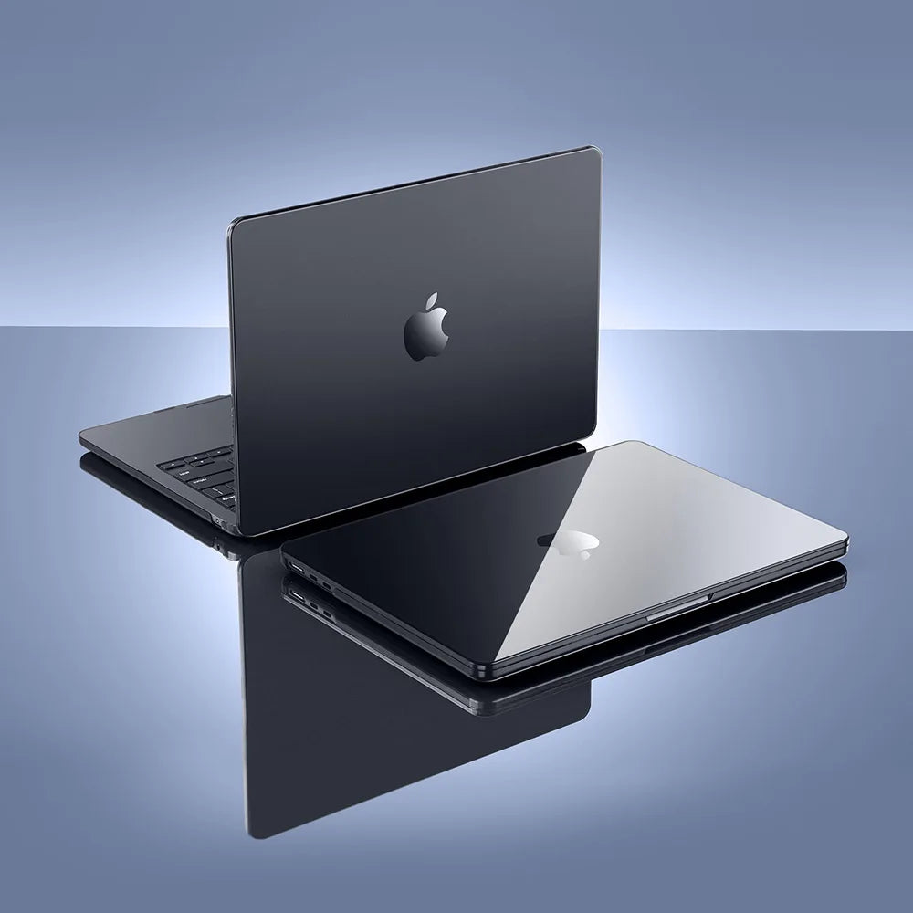 A silver ultra-slim hard shell case for a MacBook Pro is shown in various angles on a dark surface.