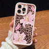 A pink leopard print phone case featuring a large pink lily floral design for an iPhone.