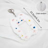 White plush photo card holder with a cat face design and a chain for decoration