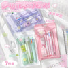 A set of cute cartoon school stationery items packaged in pink and purple plastic pouches.
