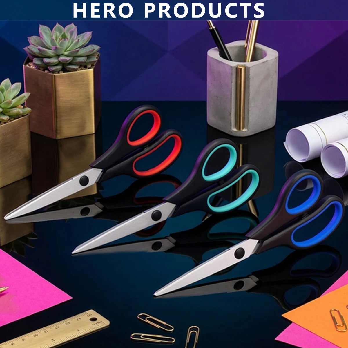 A set of black and red stainless steel scissors, rulers, and succulent plants displayed on a dark surface.