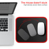 A black mouse pad with a red stitched edge is shown next to a silver laptop, demonstrating a mouse movement.