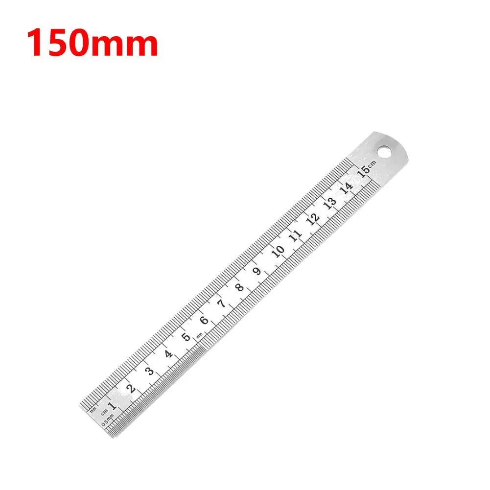 A stainless steel measuring ruler marked in millimeters, showing a scale up to 15 cm.