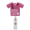 A pink glitter shirt with a black stethoscope design and the text SCRUB LIFE on the front, attached to a badge reel holder.