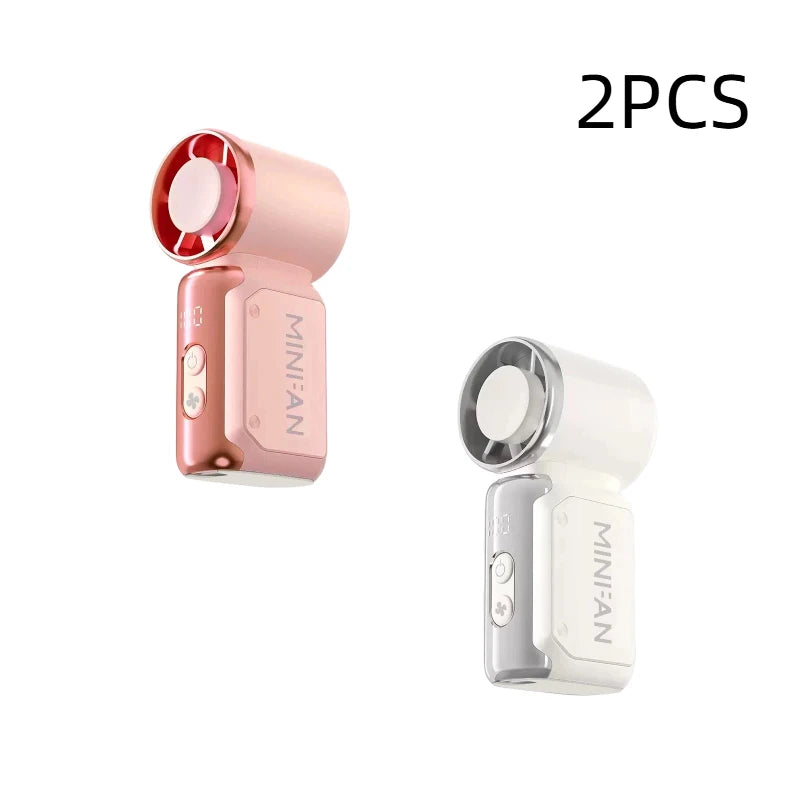 Two portable USB rechargeable mini fans, one pink and one white.