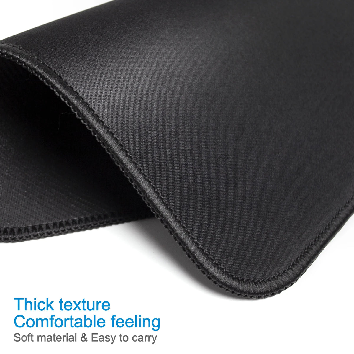 Black portable gaming mouse pad showing a thick texture and soft material for comfortable carrying