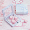 A clear plastic case holds pink cat paw and heart shaped keycaps for MX switches on a pink background.